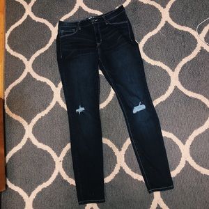 Dark wash skinny jeans with rips